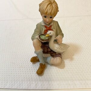 Charming Boy Feeding Goose Figurine